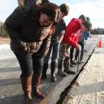 Photo by Megan Pacer/Peninsula Clarion Joseph Gottschalk, 12, and Soldotna resident Renee Duncan play a board game while waiting in a temporary shelter after people were evacuated from their homes along Lilac Lane on Sunday, Jan. 24, 2016 in Kenai, Alaska. A 7.1 magnitude earthquake caused several gas explosions in homes on Lilac Lane, and residents were evacuated to the Kenai National Guard Armory.