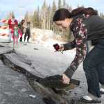 Photo by Kelly Sullivan/Peninsula Clarion Tyrrel Corveia, 14, had her parents drop her off near the 150-foot crack on Kalifornsky Beach road near Kasilof Sunday in Kasilof, Alaska. Corveia lives in a yurt and said she woke up to the structure shaking on its stilts, but said at the end her home sustained no damages.