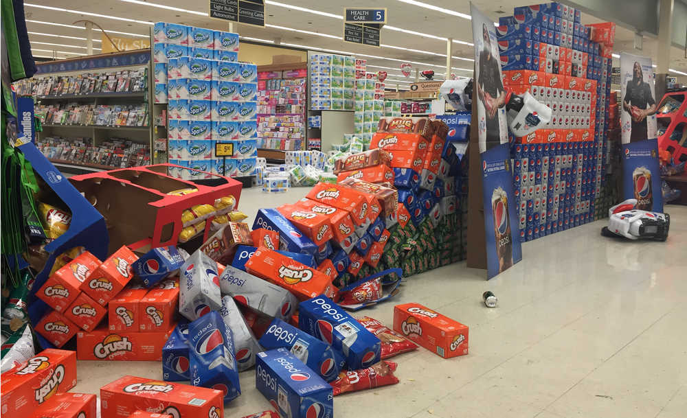 Photo by Kelly Sullivan/ Peninsula Clarion Among the damages Central Kenai Peninsula infrastructure sustained last night was a 150-foot crack on Kalifornsky Beach Road near Kasilof, Sunday, Jan. 24, 2016, in Kasilof, Alaska.