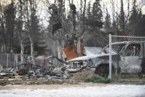 Photo by Megan Pacer/Peninsula Clarion Burnt debris litters the ground where a house used to stand on Lilac Lane on Monday, Jan. 25, 2016 in Kenai, Alaska. Gas explosions and fires took out four homes on the block following a 7.1 magnitude earthquake that hit the Lower Cook Inlet early Sunday morning.