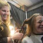 Ben Boettger/Peninsula Clarion Volunteer hairdresser Joy Conner (left) curls the hair of Alison Alley during Project Homeless Connect, an event at which local individuals and organizations provided information and services to the Kenai Peninsula's homeless population on Thursday, Jan. 28. Haircuts, massages, food, and veterinary care were among the services offered.