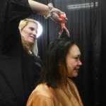 Photo by Megan Pacer/Peninsula Clarion Sandra Groller, of Kasilof, gets a haricut from Joy Conner, of Soldotna, while at Project Homeless Connect on Thursday, Jan. 28, 2016 at the Soldotna Regional Sports Complex in Soldotna, Alaska.