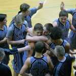 Photo by Jeff Helminiak/Peninsula Clarion Nikiski's Ian Johnson is hugged by Sam Tauriainen after Johnson made the game-winning shot in Nikiski's 58-57 victory over Monroe Catholic on Friday at Nikiski High School. Cade Anderson and Jace Kornstad high-five behind the celebration.