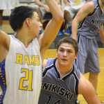 Photo by Jeff Helminiak/Peninsula Clarion Nikiski's Luke Johnson plays defense on Monroe Catholic's Will Justice on Friday at Nikiski High School.