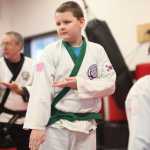 Photo by Kelly Sullivan/ Peninsula Clarion Sam Festervand concentrates during practice Thursday at Soldotna Martial Arts in Soldotna, Alaska. He attends class at the studio three days each week, which, he said, has helped him develop more confidence.