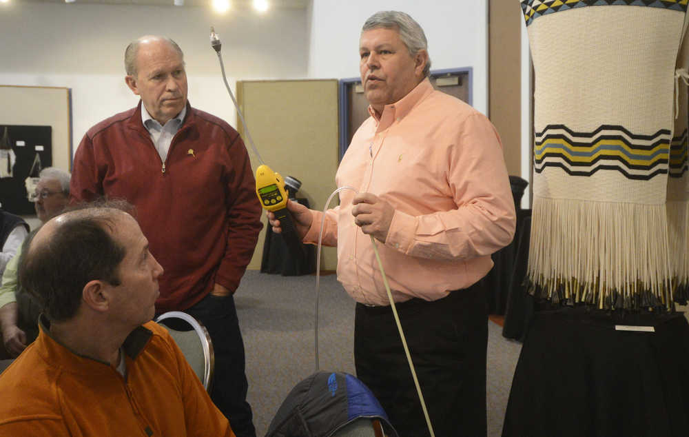 Photo by Megan Pacer/Peninsula Clarion Enstar Natural Gas Co. Southern Division Manager Charlie Pierce, right, explains how Enstar workers evaluate gas levels following an emergency while Kenai Peninsula Borough Mayor Mike Navarre, left, and Gov. Bill Walker, center, look on during a briefing on the Jan. 24 earthquake on Sunday, Jan. 31, 2016 at the Kenai Chamber of Commerce and Visitor Center in Kenai, Alaska. Walker heard from Enstar, Homer Electric Association, public safety and city officials before visiting the destroyed homes on Lilac Lane during his visit.