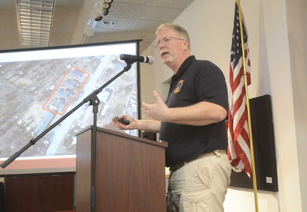 Photo by Megan Pacer/Peninsula Clarion Kenai Fire Chief Jeff Tucker explains his department's response to gas explosions and fire that followed last week's magnitude 7.1 earthquake during a briefing session on Sunday, Jan. 31, 2016 at the Kenai Chamber of Commerce and Visitor Center in Kenai, Alaska. Gov. Bill Walker heard from Tucker, city and borough public officials, and local utility companies about the aftermath of the quake.