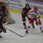 Photo by Joey Klecka/Peninsula Clarion Wasilla junior Garrett Conroy (18) is chased by Kenai sophomore Jakeb O'Brien (18) and senior Chris Hagel (14) Thursday at the North Star Conference tournament at the Soldotna Regional Sports Complex.
