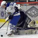 Photo by Jeff Helminiak/Peninsula Clarion Palmer's Haley Hanson can't stuff a goal by Soldotna goalie Billy Yoder in the Friday semifinals of the North Star Conference tournament at the Soldotna Regional Sports Complex.