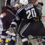 Photo by Jeff Helminiak/Peninsula Clarion Trevor Witthus (21) and Corey Hanson (20) help teammates mob goalie Billy Yoder after the Soldotna hockey team defeated Palmer 3-1 on Friday at the North Star Conference  hockey tournament at the Soldotna Regional Sports Complex to earn a state berth.