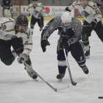Photo by Joey Klecka/Peninsula Clarion Colony senior Jake Branch (left) and Soldotna junior Jace Urban race after the puck in the second period of Saturday's North Star Conference championship game at the Soldotna Regional Sports Complex. The Knights won 3-0.