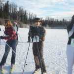 Photo by Megan Pacer/Peninsula Clarion From left to right: 18-year-old Madeleine Michaud, 18-year-old Mikaela Salzetti and 14-year-old Charly Morton take a breather after completing the Women's Stud Run 5K race on Sunday, Feb. 8, 2016 at the Tsalteshi Trails in Soldotna, Alaska. Formerly the Ski for Women, this year's Stud Run was altered to accommodate lack of snow, and partipants could choose to ski, run or snowshoe.
