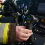 Kenai Fire Marshal Tommy Carver takes a turn using a fire engine to put out a simulated aircraft fire during an Aircraft Rescue and Firefighting drill on Monday, Feb. 15, 2016 at the Beacon Occupational Health and Safety Services Training Center in Kenai, Alaska.
