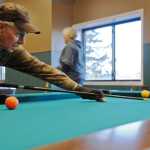 Photo by Elizabeth Earl/Peninsula Clarion Jerry Norris of Soldotna, Alaska lines up a shot at the Kenai Recreation Center during the annual Senior Olympics on Tuesday, Feb. 16, 2016.