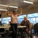 Photo by Elizabeth Earl/Peninsula Clarion Nita Douthit celebrates a strike during the Wii Bowling event of the Senior Olympics Tuesday, Feb. 16, 2016, at the Kenai Senior Center while Ray Nickelson keeps score.