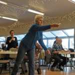 Photo by Elizabeth Earl/Peninsula Clarion Dorothy Diamond takes a swing at Wii Bowling during the Senior Olympics Tuesday, Feb. 16, 2016, at the Kenai Senior Center.