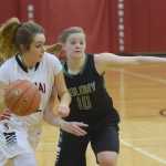 Photo by Joey Klecka/Peninsula Clarion Kenai Central forward Alexis Baker works to beat Colony guard Amanda Smith (10) Friday at Kenai Central High School.
