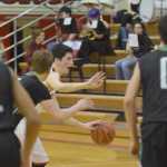 Photo by Joey Klecka/Peninsula Clarion Kenai Central guard Marshall Vest (center) dribbles the ball against Colony's Nolan Martin Friday at Kenai Central High School.