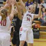 Photo by Joey Klecka/Peninsula Clarion Kenai Central forward Alli Steinbeck jumps for the rebound against Colony forward Chase Stephens (20) and Kenai teammate Abby Beck (40) Friday night at Kenai Central High School. The Kardinals lost to the Knights 36-26.