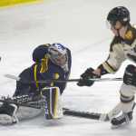 Photo by Jeff Helminiak/Peninsula Clarion Springfield Jr. Blues goalie Niko Della Maggorie saves a breakaway by Kenai River Brown Bears forward Joey Sardina on Friday at the Soldotna Regional Sports Complex.