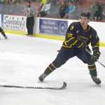 Photo by Jeff Helminiak/Peninsula Clarion Kenai River Brown Bears defenseman Davis Sebald defends Springfield Jr. Blues forward Trevor Stone on Friday at the Soldotna Regional Sports Complex.