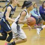 Photo by Joey Klecka/Peninsula Clarion Nikiski guard Arianna Parrish takes the ball up court with Soldotna's Daisy Nelson in tow Thursday at Nikiski High School.