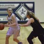 Photo by Joey Klecka/Peninsula Clarion Soldotna guard Daisy Nelson looks for an opening against a Palmer defender Friday at Soldotna High School. The Moose beat the Stars 43-22.