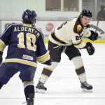 Photo by Jeff Helminiak/Peninsula Clarion Kenai River Brown Bears forward jake Eubank loads up a shot against Janesville (Wisconsin) Jets defenseman Jeff Alderfer on Friday at the Soldotna Regional Sports Complex.