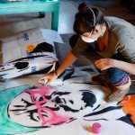 Gemma Amorelli scruffs her pet ferret Margy on Monday, Feb. 22 near Soldotna. Like kittens, ferrets become relaxed and docile when held by the scruff of the neck.