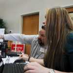 Photo by Elizabeth Earl/Peninsula Clarion Ellie Smardo (right) and Neal DuParran (left), both volunteers with the Alaska Republican Party, helped direct voters at the Kenai New Life Church during the Republican Presidential Preference Poll on Tuesday, March 1, 2016.