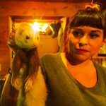 After spraying a layer of black lines, Amorelli lifts her cardboard stencil from a fresh portrait on Monday, Feb. 22 near Soldotna.