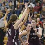 Photo by Joey Klecka/Peninsula Clarion Ninilchik forward Olivia Delgado loses her glasses amid a scrum of Nikolaevsk defenders in Friday's Peninsula Conference girls championship game at Homer High School.