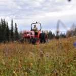 A crew from the Kenai Department of Parks & Recreation works to prepare the Field of Flowers for winter on Oct. 8, 2015. The parcel where the field is located along the Kenai Spur Highway is part of a rezoning plan that has drawn controversy.