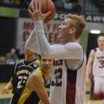 Photo by Joey Klecka/Peninsula Clarion Nikolaevsk senior forward Neil Gordeev puts up a layup against Scammon Bay in Thursday's quarterfinal round at the Class 1A March Madness state tournament at the Alaska Airlines Center in Anchorage.