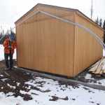 Photo by Kelly Sullivan/ Peninsula Clarion Steve Dahl takes a break from twisting and turning the metal frames of future high tunnels he will be installing on his property Tuesday, March 15, 2016, at Eagle Glade Farm LLC., in Nikiski, Alaska.