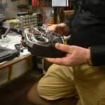 John Parker, founder of Integrated Robotic Imaging Systems, explains how unmanned aircrafts, like the UAV he keeps at his Kenai business, can be controlled from the ground on Thursday, Feb. 25, 2016 at the business on Main Street Loop in Kenai, Alaska.