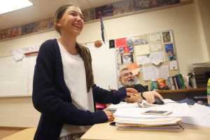 Photo by Kelly Sullivan/ Peninsula Clarion Social Studies teacher Rob Moore steals the mouse from Gabriella Rogers during a morning practice session Friday, March 25, 2016, at Skyview Middle School in Soldotna, Alaska.