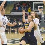 Photo by Joey Klecka/Peninsula Clarion Homer senior guard Aurora Waclawski drives to the rim amid a sea of Barrow defenders in Saturday's Class 3A girls state championship game at the Alaska Airlines Center.