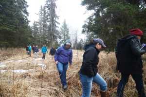 Photo by Megan Pacer/Peninsula Clarion Kenaitze Indian Tribe members, students and Kenai Peninsula College faculty get ready for an opening prayer led by Dena'ina Elder Max Chickalusion Jr. on Thursday, March 24, 2016 at Kalifornsky Village off of Kalifornsky Beach Road in Alaska.