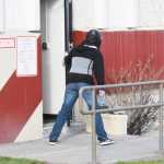 Photo by Megan Pacer/Peninsula Clarion Koebryn Mlynarik enters the Kenai Peninsula Borough building during an active shooter simulation as part of this year's Alaska Shield exercise on Thursday, March 31, 2016 in Soldotna, Alaska.