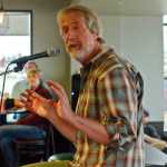 Storyteller James Bennett relates a travel story during a storytelling evening on Friday, April 1 at Odie's Deli in Soldotna.