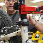 Photo by Elizabeth Earl/Peninsula Clarion Cyclists should check their brake pads at the beginning of the season for wear and tear. Sometimes damage to the rim can limit the brake effectiveness, so during a tune-up, mechanics at Beemun's will run a rough pad over the rim to remove any splinters.