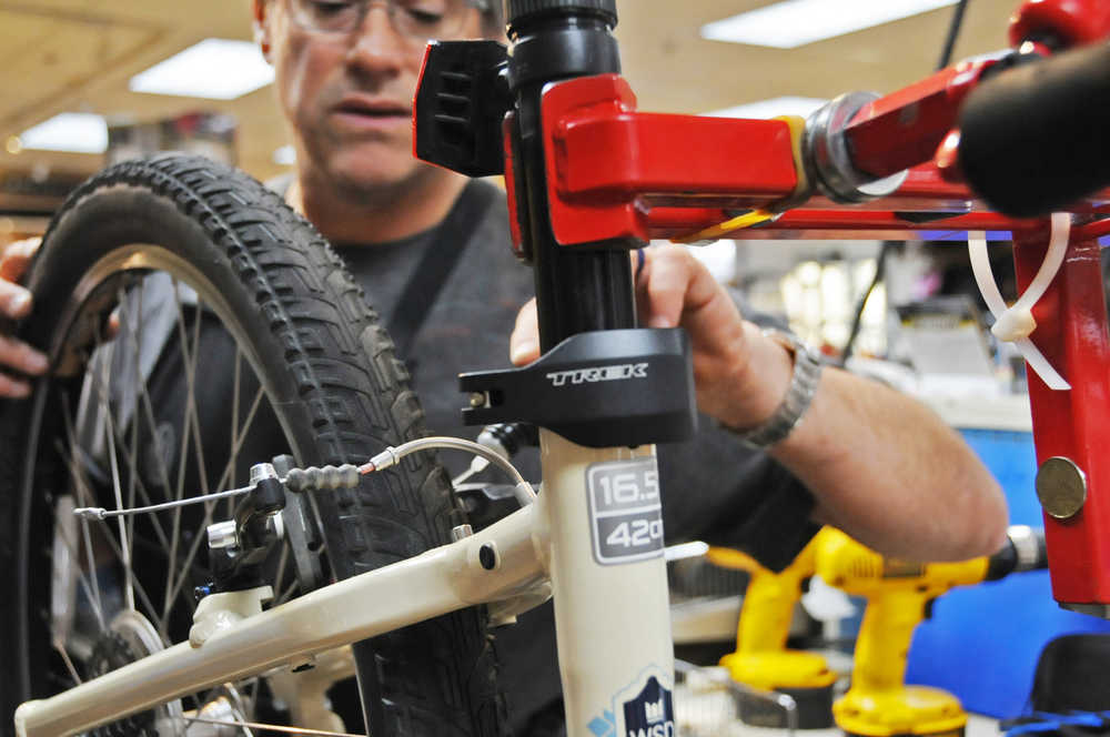 Photo by Elizabeth Earl/Peninsula Clarion Cyclists should check their brake pads at the beginning of the season for wear and tear. Sometimes damage to the rim can limit the brake effectiveness, so during a tune-up, mechanics at Beemun's will run a rough pad over the rim to remove any splinters.