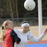 Photo by Jeff Helminiak/Peninsula Clarion Kenai Central's Samantha Morse and Soldotna's Sarah Federle joust for the ball Thursday at Soldotna High School.