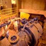 After flowing from the lake through an approximately 19,152 foot tunnel from Bradley Lake, water enters the power station through a large blue pipe, photographed on Friday, April 15 at the Bradley Lake Hydroelectric plant. The water will spin a pair of turbines, generating about 376 gigawatt hours of electricity per year.