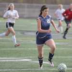 Soldotna sophomore Whitney Wortham drives the ball down the field during a 2-1 win over Colony April 23 at Colony High School.