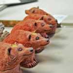 Photo by Elizabeth Earl/Peninsula Clarion Hand-crafted boxes in the shape of bears, made by Kenai Potters Guild president Laura Faeo, wait to be placed in the kiln at the Kenai Fine Arts Building on Friday, April 15, 2016. Once fired for 12 hours and cooled for several days, the bears will be ready to be sold.