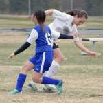 Photo by Jeff Helminiak/Peninsula Clarion Nikiski's Rylee Jackson cuts back on Kodiak's Trisha Mamaat on Thursday in the first half of action at Nikiski High School.
