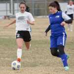 Photo by Jeff Helminiak/Peninsula Clarion Nikiski's Zykiah Cooner and Kodiak's Miranda Alexander battle for the ball Tuesday at Nikiski High School.