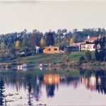 Photo courtesy Mullican family The Mullican family built the original brick house (left) when they arrived on their homestead on Sevena Lake in the 1960s, and Clyde and Roseanna Mullican built the bigger house (right) after they retired.